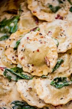 some ravioli with spinach and cheese on top