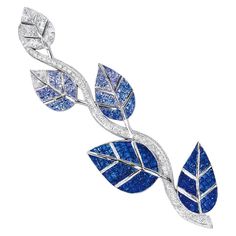 An extraordinary set 18 karat white gold , Diamond and Blue Sapphire leaf brooch. Each of the five leaves are invisibly set with Princess Cut stones. The top leaf starts in all white Diamonds slowly following to shaded colors of Blue Sapphires . The ombre tones of blues give a unique quality to this very special brooch. The center stem is set with round Brilliant Diamonds. The brooch measures 4" in length. 103 round Diamonds =1.48 carats 48 princess cut Diamonds=2.20 carats 208 shaded Blue Sapph Earing Jewellery, Men's Brooch, Leaf Brooch, Diamond Brooch, Blue Jewelry, Moda Vintage, Sapphire Jewelry, Jewelry Online Shopping, Gemstone Engagement Rings