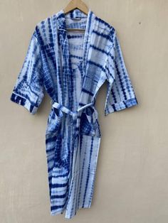 This Robe we makes from 100% Cotton printed fabric.The fabric print is Anokhi Floral which is very popular in all over the world .We use pure cotton cambric fabric .This is free One size robe .There is both side pocket in robe.Length = 120 cms. ( 48 inches) Blue Summer Sleepwear For Home, Summer Sleepwear Kimono With Prints, Fitted Summer Robe For The Beach, Fitted Summer Beach Robe, Blue Summer Kimono For Home, Summer Cotton Sleep Kimono, Summer Blue Kimono For Home, Blue Cotton Home Robe, Blue Summer Robe With Kimono Sleeves