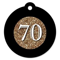 a black and gold 70th birthday ornament with the number seventy on it's center