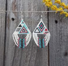 the earrings are made with seed beads and beaded in turquoise, red, and white