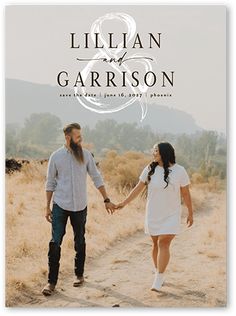 an image of a couple holding hands walking through the desert in their wedding announcement card