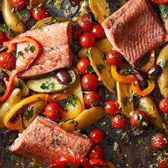 salmon, peppers and mushrooms on a sheet of foil with seasoning sprinkles