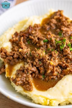 mashed potatoes topped with ground beef and gravy