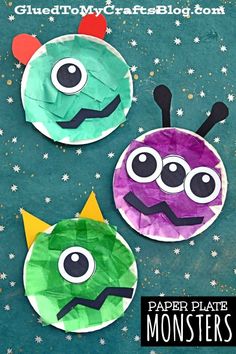 three paper plate monsters on a blue background