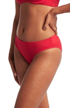 A fold-over waist sweetly shapes these bikini bottoms styled with a classic fit, versatile solid hue and moderate back coverage. 85% recycled nylon, 15% elastane   Hand wash, line dry   Imported Sea Level, Hand Wash, Nordstrom, Band, Red