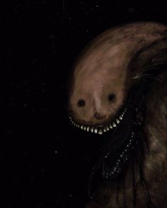 an animal with teeth on it's face in the dark