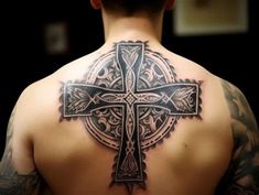 a man with a cross tattoo on his back