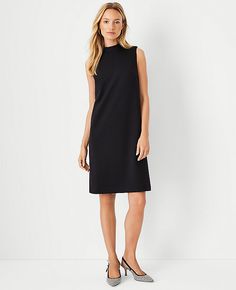 Elevate your wardrobe with the Ann Taylor Petite Mock Neck Shift Dress, a testament to sophisticated style paired with comfort. This dress features a sleek mock neck and a sleeveless design, perfect for seamless layering or wearing as a standout piece.

- Size: Petite 4
- Color: Black
- Material: 78% Polyester, 15% Rayon, 7% Spandex; Lining: 100% Polyester
- Length: Hits at knee, 21" from natural waist
- Closure: Hidden back zipper with hook-and-eye

Crafted in a double knit fabric that resists Knitted Suit, Shift Dress Black, Feminine Dress, Sleeveless Sheath Dress, Ann Taylor Dresses, Double Knit, Chic Woman, Double Knitting, Stylish Dresses