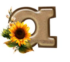 the letter g is made up of sand and has sunflowers on top of it