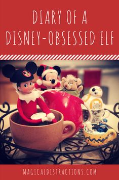 an elf with mickey mouse figurines and other toys on a tray that says, diary of a disney - obsesed elf