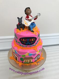 a birthday cake with a man playing the guitar