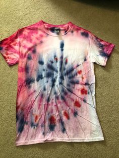 Hand-dyed red, white and blue t-shirt. Comes in an adult unisex small. Casual Multicolor T-shirt For 4th Of July, Blue Patriotic T-shirt For Spring, Patriotic Multicolor Short Sleeve T-shirt, Multicolor Cotton T-shirt For 4th Of July, Patriotic Multicolor Graphic Print T-shirt, Patriotic Multicolor T-shirt With Graphic Print, Bleached Multicolor Graphic Tee, Multicolor Crew Neck T-shirt For 4th Of July, Multicolor Relaxed Fit Soft-washed T-shirt