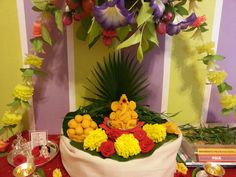 an arrangement of flowers and food on a table