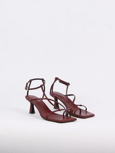 Editor's NotesThese structured sandals will elevate your summer wardrobe - Square open toe- Toe ring- Strappy silhouetteMeasurements (in.)- Size: KR225(US5.5) - KR 255(US8.5)- Heel height: 2.4 in.- Fits true to the sizeComposition & Care- Cow leather, Pig Skin, Rubber Sole- Avoid water, oil, perfume, and makeup- When wet, don't wipe and dry while avoiding direct sunlight or heat- Use a colorless cloth to absorb moisture- Avoid color transferDesigner- Imported- by blanc sur blanc Summer Formal T-strap Sandals With Heel Loop, Evening Toe Post Sandals With Heel Loop, Formal Sandals With Wrapped Heel And Toe Post, Modern Open Toe T-strap Sandals For Formal Occasions, Formal Toe Post Sandals With Buckle Closure, Elegant Summer Toe Ring Sandals With Heel Loop, Elegant Toe Ring Sandals With Heel Loop, Elegant Toe Ring Sandals With Heel Loop For Summer, Elegant Toe Post Slingback Sandals With Heel Strap