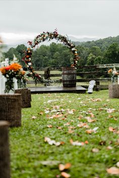 an outdoor ceremony set up in the grass