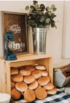 a wooden shelf filled with lots of donuts