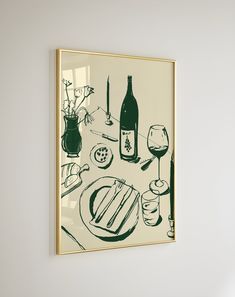 a painting hanging on the wall above a table with food and wine in front of it