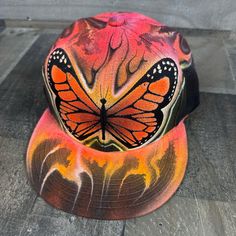 This is an airbrushed snapback hat featuring a Butterfly design.  This hat is adjustable and will fit almost anyone.  These hats are waterproof and can withstand a good soaking but they should not be washed in a washing machine or dish washer.  Thank you, Brad.  Shipping is free for this item anywhere in the US. Airbrush Hat Ideas, Airbrush Hat, Air Brush Art, Brush Art, East Lansing, Lansing Mi, Dish Washer, Air Brush, Hat Ideas