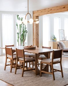 a dining room table with six chairs around it