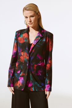 A striking blend of art and fashion, this blazer serves a contemporary twist on a classic design. The garment is tailored in a luxurious silky knit fabric boasting a stunning floral print whose chic appeal will stand the test of time. The sleek notched collar adds an air of confidence while the faux front flap pockets and single-button closure complement the blazer’s polished straight silhouette. DETAILS & CARE 95% Polyester, 5% Spandex Silky knit fabric Notched collar Long sleeves Faux front fl Kate And Pippa, Art And Fashion, Floral Blazer, Joseph Ribkoff, Blazer Fashion, Notched Collar, Signature Collection, Trending Dresses, Knit Jacket