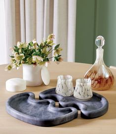 a table with vases and other items on it