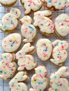 decorated cookies on a cooling rack with sprinkles