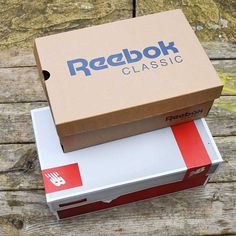 a box sitting on top of another box that says reebok classic in it