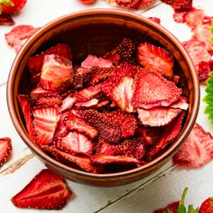 sliced strawberries in a bowl on a table