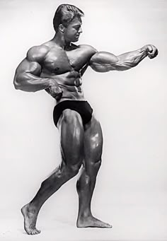 an old photo of a man with muscles