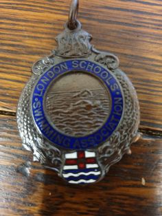 an award medal is sitting on a wooden table