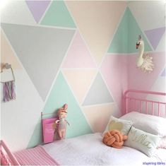 a child's bedroom decorated in pastel colors