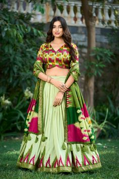 This elegant stitched lehenga set is crafted from luxurious tussar silk, featuring beautiful prints enhanced with foil work. secured with a drawstring, heavy tassels, and a zip. It is stitched with canvas and includes can can for added volume, with a length of 42 inches and a flair. The inner lining is made of soft micro cotton for added comfort. Completing the ensemble is a tussar silk dupatta, printed with foil work, and measuring 2.5 meters in length. This stunning outfit combines traditional charm with modern elegance, perfect for any special occasion.

#TussarSilk
#FoilPrint
#ElegantLehenga
#TraditionalWear
#DesignerLehenga
#FestiveFashion
#WeddingWear
#EthnicChic
#CulturalElegance
#SilkLehenga
#LehengaCholi
#FashionInspiration
#BridalFashion
#EthnicOutfit
#StatementOutfit Gujarati Chaniya Choli, Kalamkari Design, Zip Stitching, Garba Dress, Kalamkari Designs, Pista Green, Lehenga Choli Wedding, Stitched Lehenga, Lehenga Online