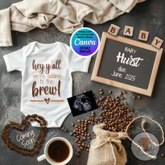 a baby announcement with coffee beans, photo frame and other items to make it personalized