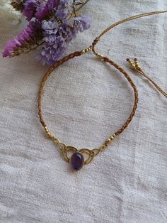 Amethyst Choker Necklace With Brass Micro macrame choker necklace with small Amethyst ( 17 mm.)  Brass Waxed thread: Camel/wood Adjustable lenght Sliding knot. ❤️ GIFT MODE: You'll receive it within a cardboard box with a cloth bag and wrapped as a gift. ❤️ CHOOSE YOUR STONE: AMETHYST PROPERTIES: Amethyst is a natural tranquiliser. Is a stone of spiritual protection and purification. ❤️ SHIPPING: EUROPEAN UNION: If you choose srandard shipping, your order will have a tracking number. You've DHL Amethyst Properties, Micro Macramé, Gold Choker Necklace, Gold Choker, Amethyst Jewelry, Moonstone Jewelry, Beautiful Gifts, Cloth Bags, Gemstone Necklace