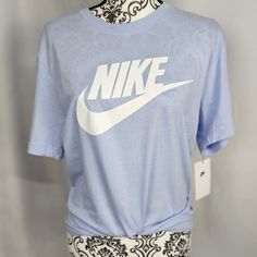 Brand New With Tags! Smoke And Pet Free Home Nike The Nike Tee Graphic T-Shirt Color: Periwinkle (Blue/Purple) White Swoosh And Lettering Ribbed Crewneck-Line Short Sleeves 100% Cotton This Shirt Is Based On A Men's Sizing. Mens Size: Small Women's Size Medium Length: 29" | Width 19" Thanks For Checking It Out! Nike Shirts Women's, Saints Shirts, Pink Tee Shirt, Women Shirt Top, Nike Shirt, Nike Tee, Dri Fit Shirt, Ladies Tee Shirts, Yellow Shorts