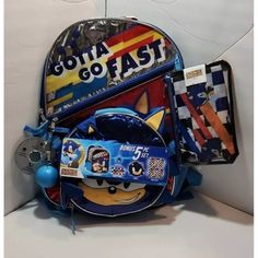 This Is A Sonic The Hedgehog Backpack Set Designed For Kids. The Backpack Features The Brand T.H.E. And The Character Sonic The Hedgehog With The Phrase "Gotta Go Fast". The Set Includes Five Pieces And Is Made Of Polyester And Nylon Materials. The Backpack Is Medium-Sized And Has A Multicolor Design. It Is Perfect For Sonic The Hedgehog Fans Who Need A Backpack For School Or Other Activities. Sonic The Hedgehog Backpack, Converse Backpack, Disney Princess Backpack, Disney Junior Mickey Mouse, Princess Backpack, Fast 5, Purse Storage