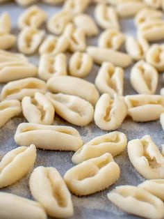 some kind of food that is laying out on a sheet of wax paper and ready to be cooked