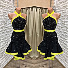 the dress is black and yellow with polka dots