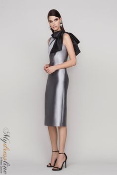 Looking for a sleek and sophisticated sleeveless dress? Check out the Frascara 4112. This stunning dress features a draped bodice with a bow at the shoulder, and a sheath skirt silhouette with a back vent. It's made from 51% silk and 49% wool, and it's satin-lined for a luxurious feel. Plus, it has a hidden back zipper for easy on and off. Sleeveless Satin Evening Dress For Black-tie Events, Fitted Tie-back Evening Dress For Formal Events, Elegant Party Dress With Tie Back, Fitted Evening Dress With Tie Back For Formal Occasions, Formal Fitted Evening Dress With Tie Back, Elegant Tie Back Dress For Party, Elegant Silk Evening Dress For Gala, Satin Dress With Bow Tie Back For Gala, Chic Evening Dress With Tie Back For Gala