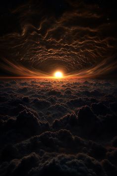 the sun is setting over some clouds in the sky with it's light shining