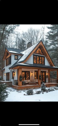 a large house in the snow with lots of windows