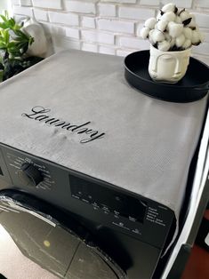 a black dishwasher sitting on top of a counter