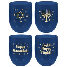 four wine glasses with happy hanukkah written on the side and gold lettering