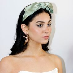 Our Le Double Bow Satin Headband: an ultra-chic refined layered bow headband inspired by the great femme fatales of the 1960s whose bows became fashion staples for generations to come. Carefully structured featuring fine draped pleating that creates just the right amount of volume. An instant makeover in a headband. Made in NYC. Layered Bow, Fashion Staples, Satin Headband, Face Drawing Reference, Black Tulips, Double Bow, The 1960s, Bow Headband, Scrunchies