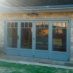 the front entrance to a building with glass doors