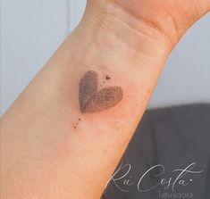 a heart shaped finger print on the wrist