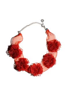 Adjustable rusty red ribbon choker with florette accents. Chain link closure. Fabric is 78% vegetal polyamide, 15% natural agate, 5% brass, 2% tin. Measures 15" in total length. Adjusts to fit 11.5" - 15". Luxury Festive Round Choker, Affordable Adjustable Red Choker, Adjustable Handmade Flower Necklaces For Parties, Bohemian Adjustable Flower Necklace For Parties, Adjustable Bohemian Flower Necklace For Party, Adjustable Handmade Flower Necklace For Party, Adjustable Red Flower Necklace, Red Elegant Flower Necklace, Elegant Red Flower Necklace