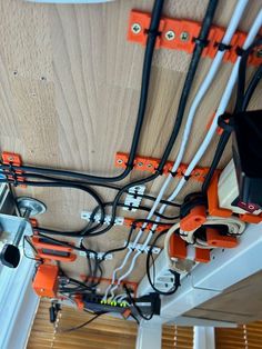 an overhead view of wires and electrical equipment in a room with wood paneling on the ceiling