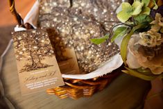 a basket filled with lots of brownies next to a card on top of a table